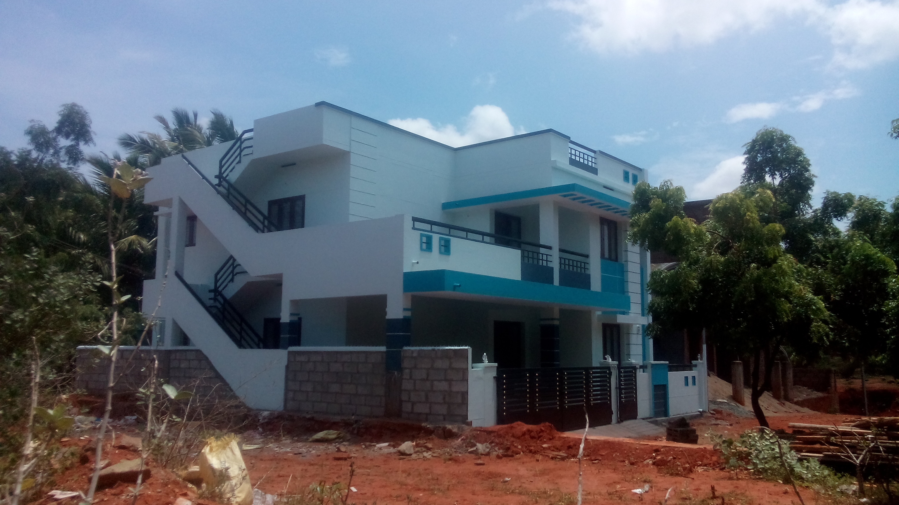 A G+1 residential house painting work on progress at Nagercoil